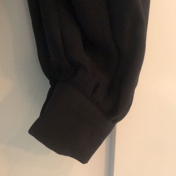 Frame sheer top with elastic detail around the yoke area. Black - Picture 3 of 6